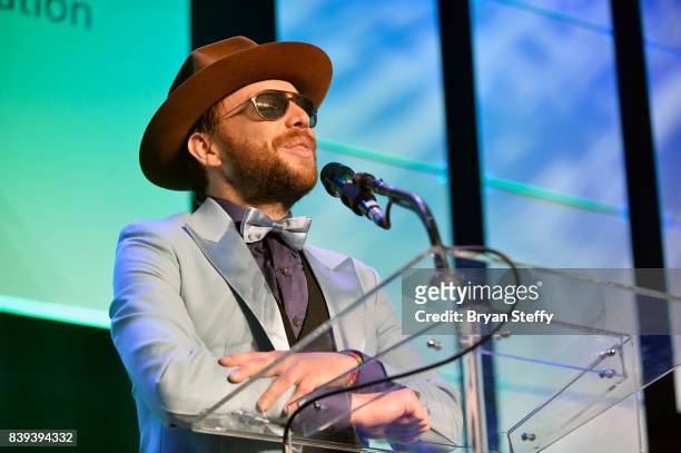 Bassist Ben Mckee of Imagine Dragons speaks during the Tyler Robinson Foundation's 4th annual 'Believer Gala' at Caesars Palace on August 25, 2017 in...