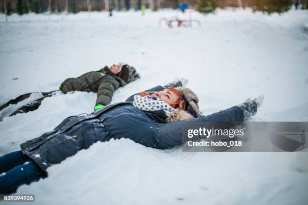 making snow angel - hot boy body stock pictures, royalty-free photos & images