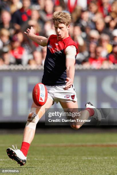 Mitch Hannan of the Demons kicks the ball during the round 23 AFL match between the Collingwood Magpies and the Melbourne Demons at Melbourne Cricket...