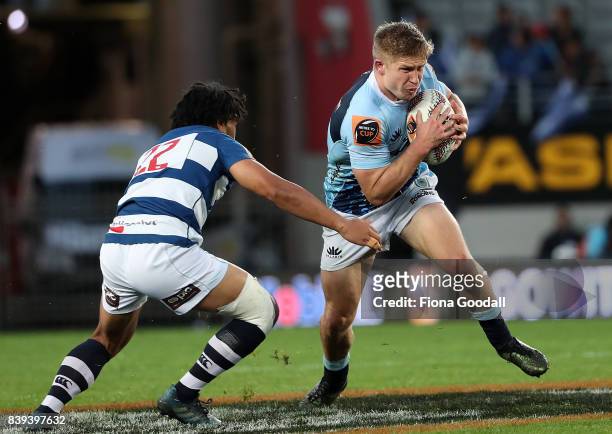 Jack Goodhue of Northland is tackled by George Moala of Auckland during the round two Mitre 10 Cup match between Auckland and Northland at Eden Park...