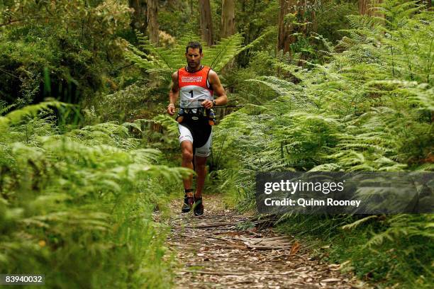 Richard Ussher of New Zealand runs through the forest during the Anaconda Adventure Race at George River on December 7, 2008 in Lorne, Australia.