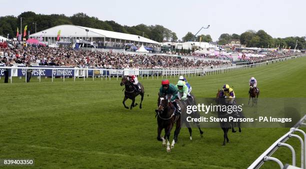 Fox Hunt ridden by Silvestre De Sousa wins the Investec Surefooted Handicap during the Investec Derby Festival, at Epsom Downs Racecourse.