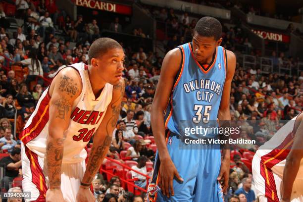 Michael Beasley of the Miami Heat and Kevin Durant of the Oklahoma City Thunder during the game Miami Heat against the Oklahoma City Thunder on...