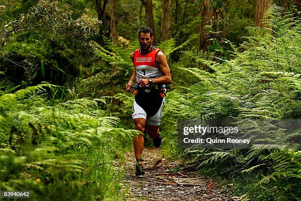 Richard Ussher of New Zealand runs through the forest during the Anaconda Adventure Race at George River on December 7, 2008 in Lorne, Australia.