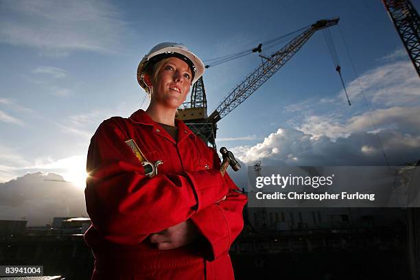 Cammell Laird apprentice Lacie Cudden, aged 17, poses at the company's shipyard where she is learning traditional ship building skills on December 5...