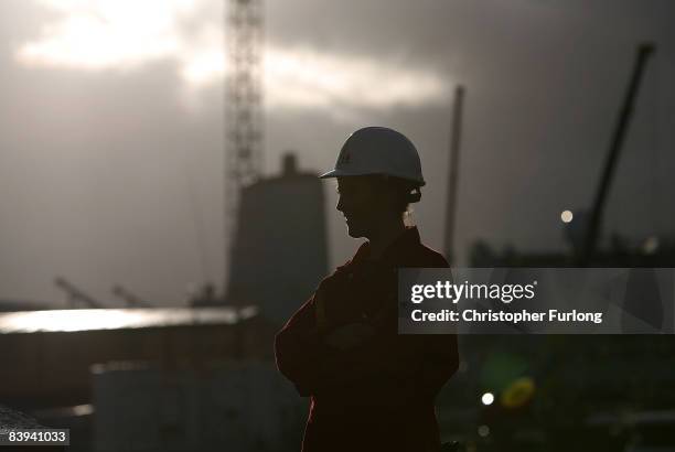 Cammell Laird apprentice Lacie Cudden, aged 17, poses at the company's shipyard where she is learning traditional ship building skills on December 5...