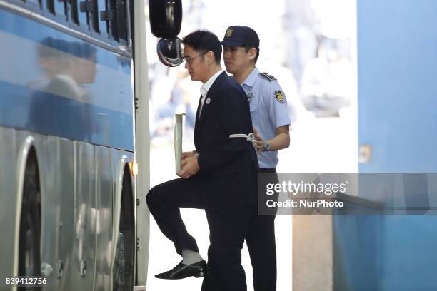 Lee Jae-yong, vice chairman of Samsung Electronics Co., leave after his verdict trial at the Seoul Central District Court on August 25, 2017 in...