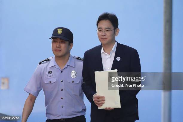 Lee Jae-yong, vice chairman of Samsung Electronics Co., leave after his verdict trial at the Seoul Central District Court on August 25, 2017 in...