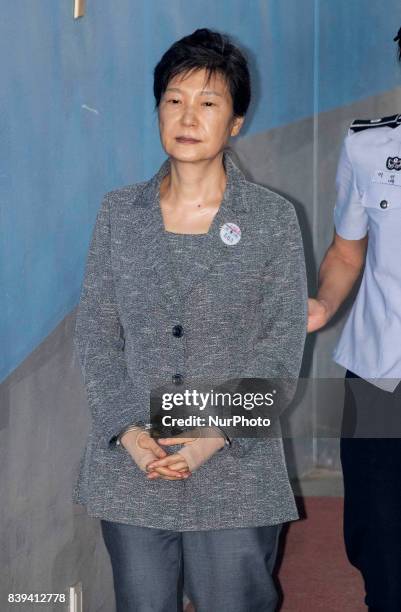 Park Geun-hye, former president of South Korea, , is escorted by prison officer as she arrives at the Seoul Central District Court in Seoul, South...