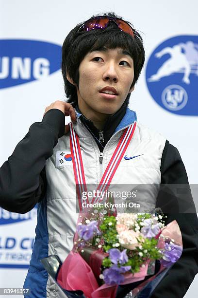 Gold medalist Lee Ho-suk of South Korea celebrates on the podium at the award ceremony after the Men's 1500m final during the Samsung ISU World Cup...