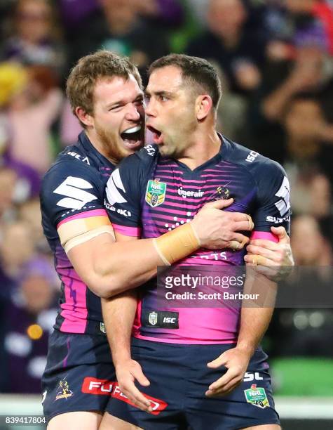 Cameron Smith of the Storm celebrates with Tim Glasby after scoring a try during the round 25 NRL match between the Melbourne Storm and the South...