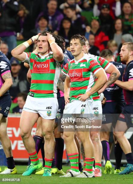 Rabbitohs players look dejected after the Storm score a try during the round 25 NRL match between the Melbourne Storm and the South Sydney Rabbitohs...