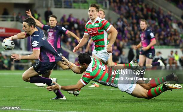 Billy Slater of the Storm runs in to score a try during the round 25 NRL match between the Melbourne Storm and the South Sydney Rabbitohs at AAMI...