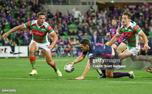 Billy Slater of the Storm runs in to score a try during the round 25 NRL match between the Melbourne Storm and the South Sydney Rabbitohs at AAMI...