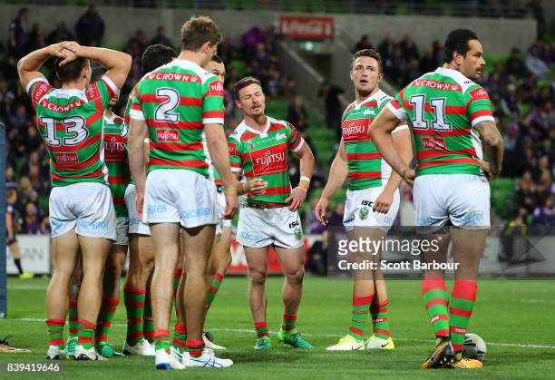 Rabbitohs players look dejected after the Storm score a try during the round 25 NRL match between the Melbourne Storm and the South Sydney Rabbitohs...