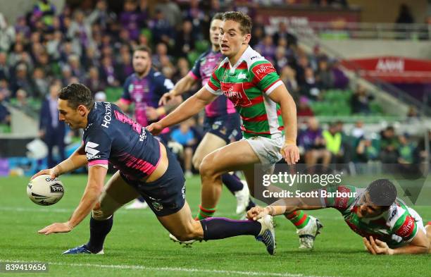 Billy Slater of the Storm runs in to score a try during the round 25 NRL match between the Melbourne Storm and the South Sydney Rabbitohs at AAMI...