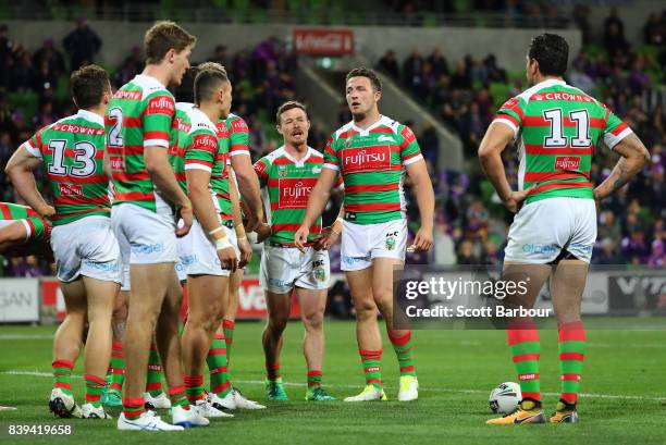 Rabbitohs players look dejected after the Storm score a try during the round 25 NRL match between the Melbourne Storm and the South Sydney Rabbitohs...