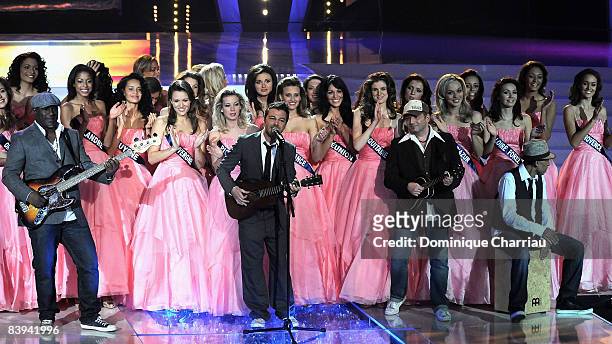 French singer Christophe Mae perform on stage surrounded by miss during the Miss France Pageant 2009 on December 6, 2008 at Le Puy du Fou, France