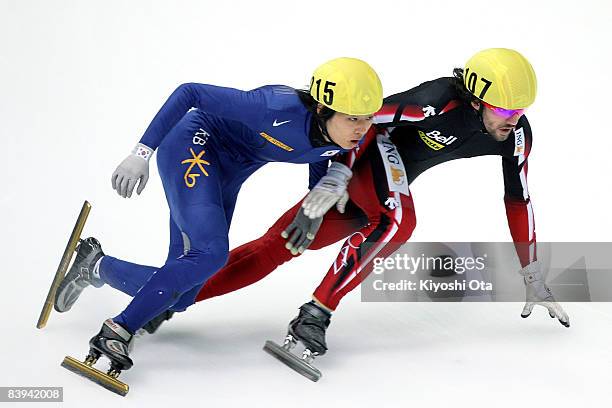 Charles Hamelin of Canada and Sung Si-bak of South Korea compete in the Men's 5000m Relay final during the Samsung ISU World Cup Short Track...