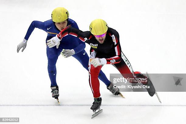 Charles Hamelin of Canada and Sung Si-bak of South Korea compete in the Men's 5000m Relay final during the Samsung ISU World Cup Short Track...