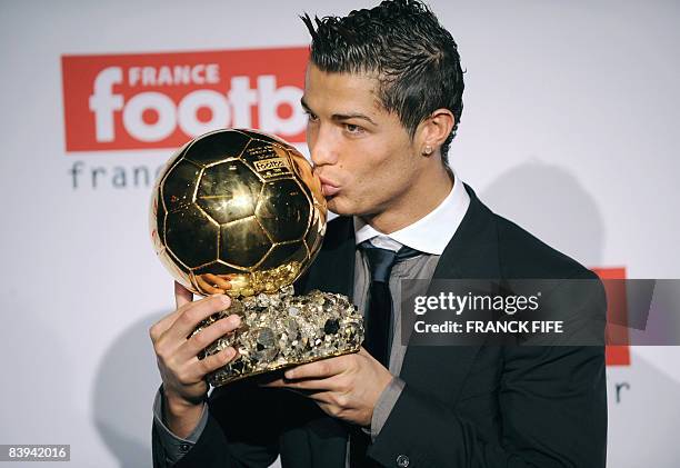 Manchester United Portuguese winger Cristiano Ronaldo kisses his trophy after he received the European footballer of the year award, the "Ballon...