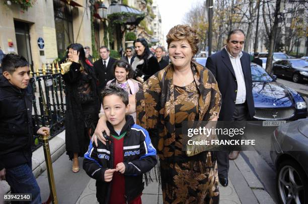 Manchester United Portuguese winger Cristiano Ronaldo's, mother Maria Dolores dos Santos Aveiro poses with a supporter on December 7, 2008 at an...