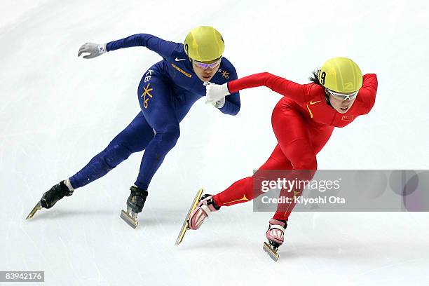 Zhang Hui of China and Yang Shin-young of South Korea compete in the Ladies' 3000m Relay final during the Samsung ISU World Cup Short Track 2008/2009...