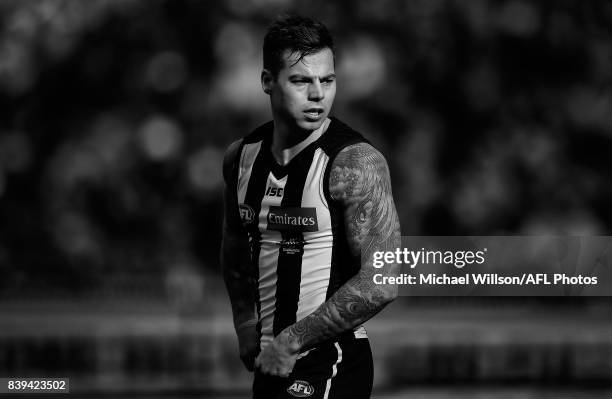 Jamie Elliott of the Magpies looks on during the 2017 AFL round 23 match between the Collingwood Magpies and the Melbourne Demons at the Melbourne...