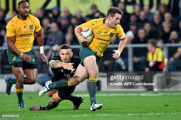 Australia's Bernard Foley is tackled by New Zealand's Sonny Bill Williams during the second Bledisloe Cup match between New Zealand and Australia...