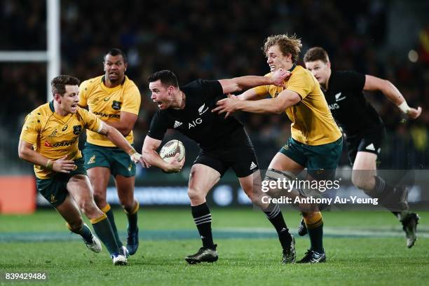 Ryan Crotty of the All Blacks on the charge against Ned Hanigan of the Wallabies during The Rugby Championship Bledisloe Cup match between the New...