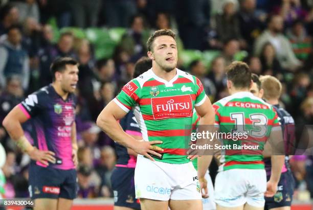 Sam Burgess and Rabbitohs players look dejected at the full time siren after the round 25 NRL match between the Melbourne Storm and the South Sydney...