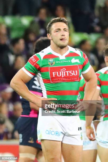 Sam Burgess and Rabbitohs players look dejected at the full time siren after the round 25 NRL match between the Melbourne Storm and the South Sydney...