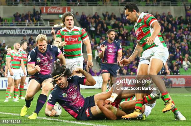 Tohu Harris of the Storm scores a try during the round 25 NRL match between the Melbourne Storm and the South Sydney Rabbitohs at AAMI Park on August...