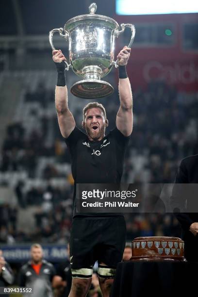 Kieran Read of the All Blacks holds up the Bledisloe Cup following The Rugby Championship Bledisloe Cup match between the New Zealand All Blacks and...