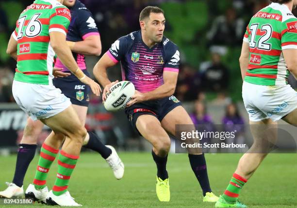 Cameron Smith of the Storm runs with the ball during the round 25 NRL match between the Melbourne Storm and the South Sydney Rabbitohs at AAMI Park...