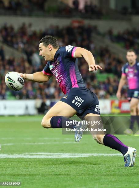 Billy Slater of the Storm runs with the ball during the round 25 NRL match between the Melbourne Storm and the South Sydney Rabbitohs at AAMI Park on...