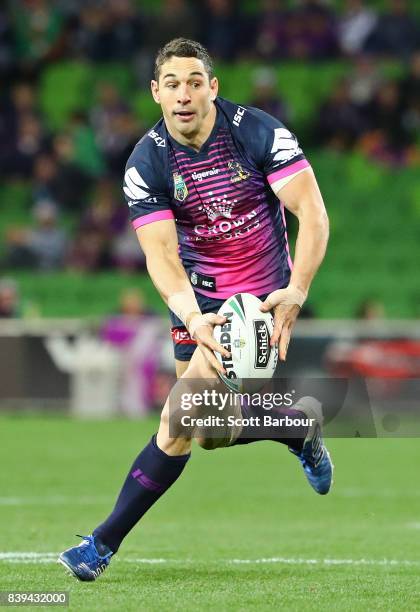 Billy Slater of the Storm runs with the ball during the round 25 NRL match between the Melbourne Storm and the South Sydney Rabbitohs at AAMI Park on...