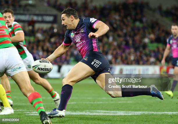 Billy Slater of the Storm runs in to score a try during the round 25 NRL match between the Melbourne Storm and the South Sydney Rabbitohs at AAMI...