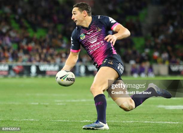 Billy Slater of the Storm runs with the ball during the round 25 NRL match between the Melbourne Storm and the South Sydney Rabbitohs at AAMI Park on...