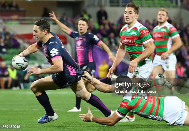 Billy Slater of the Storm runs in to score a try during the round 25 NRL match between the Melbourne Storm and the South Sydney Rabbitohs at AAMI...