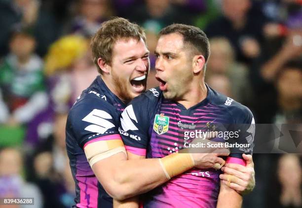 Cameron Smith of the Storm celebrates with Tim Glasby after scoring a try during the round 25 NRL match between the Melbourne Storm and the South...