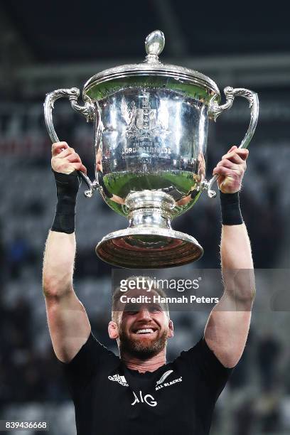 Kieran Read of the All Blacks lifts the Bledisloe Cup after winning The Rugby Championship Bledisloe Cup match between the New Zealand All Blacks and...
