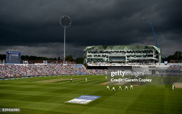 Dark clouds as Stuart Broad of England runs into bowl during day two of the 2nd Investec Test between England and the West Indies at Headingley on...