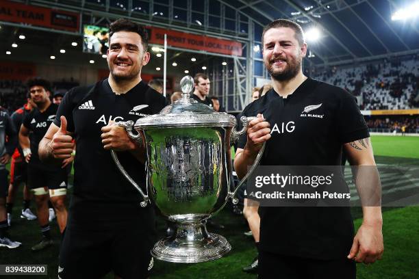 Codie Taylor and Dane Coles of the All Blacks celebrate with the Bledisloe Cup after winning The Rugby Championship Bledisloe Cup match between the...