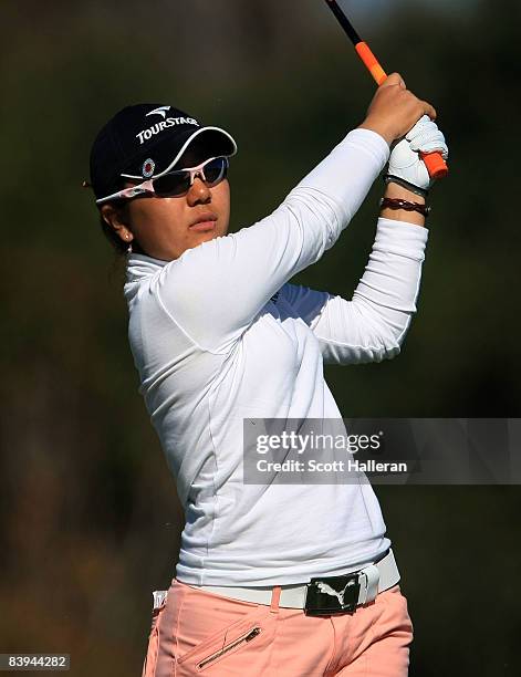 Mika Miyazato of Japan watches her tee shot on the 14th hole during the final round of the LPGA Qualifying School at LPGA International on December...