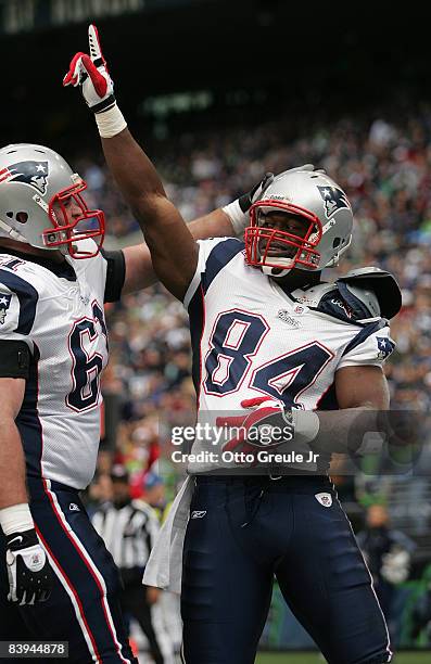 Tight end Benjamin Watson of the New England Patriots celebrates with Stephen Neal after scoring a touchdown against the Seattle Seahawks on December...