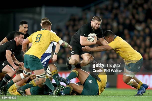 Dane Coles of the All Blacks is tackled during The Rugby Championship Bledisloe Cup match between the New Zealand All Blacks and the Australia...