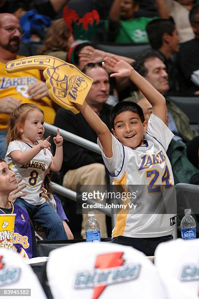Fans dance during a break in the action of the game between the Tulsa 66ers and the Los Angeles D-Fenders at Staples Center on December 7, 2008 in...