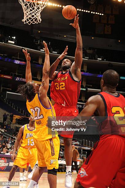 Chris Richard of the Tulsa 66ers puts up a shot against Marcus White of the Los Angeles D-Fenders at Staples Center on December 7, 2008 in Los...
