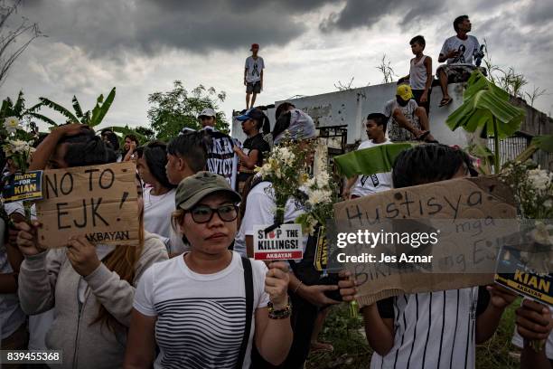 Protesters march on the street shouting slogans against the police and to call for justice on August 26, 2017 in Caloocan city, Philippines. More...